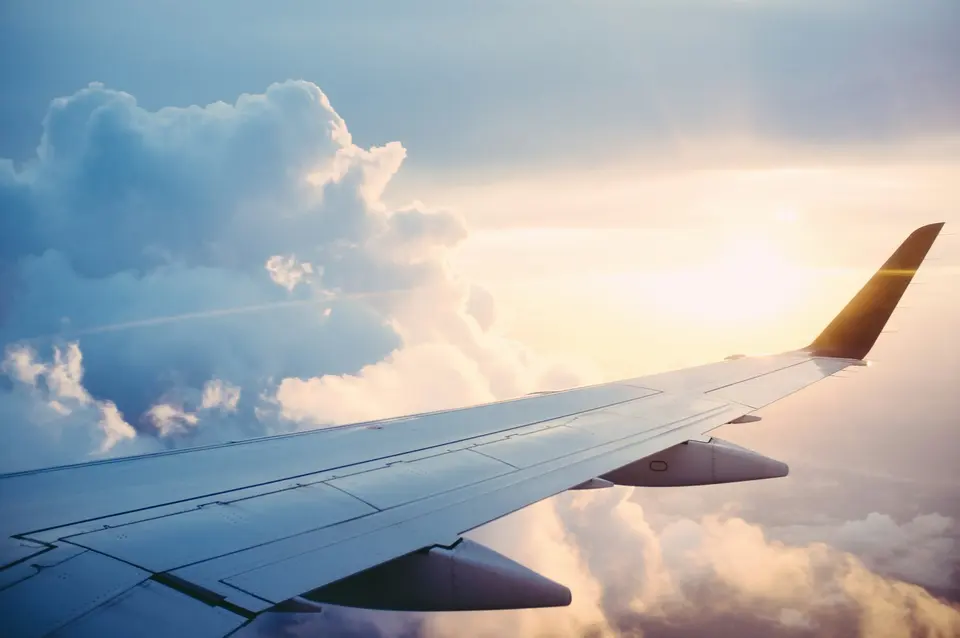 View from an aeroplane window above the clouds
